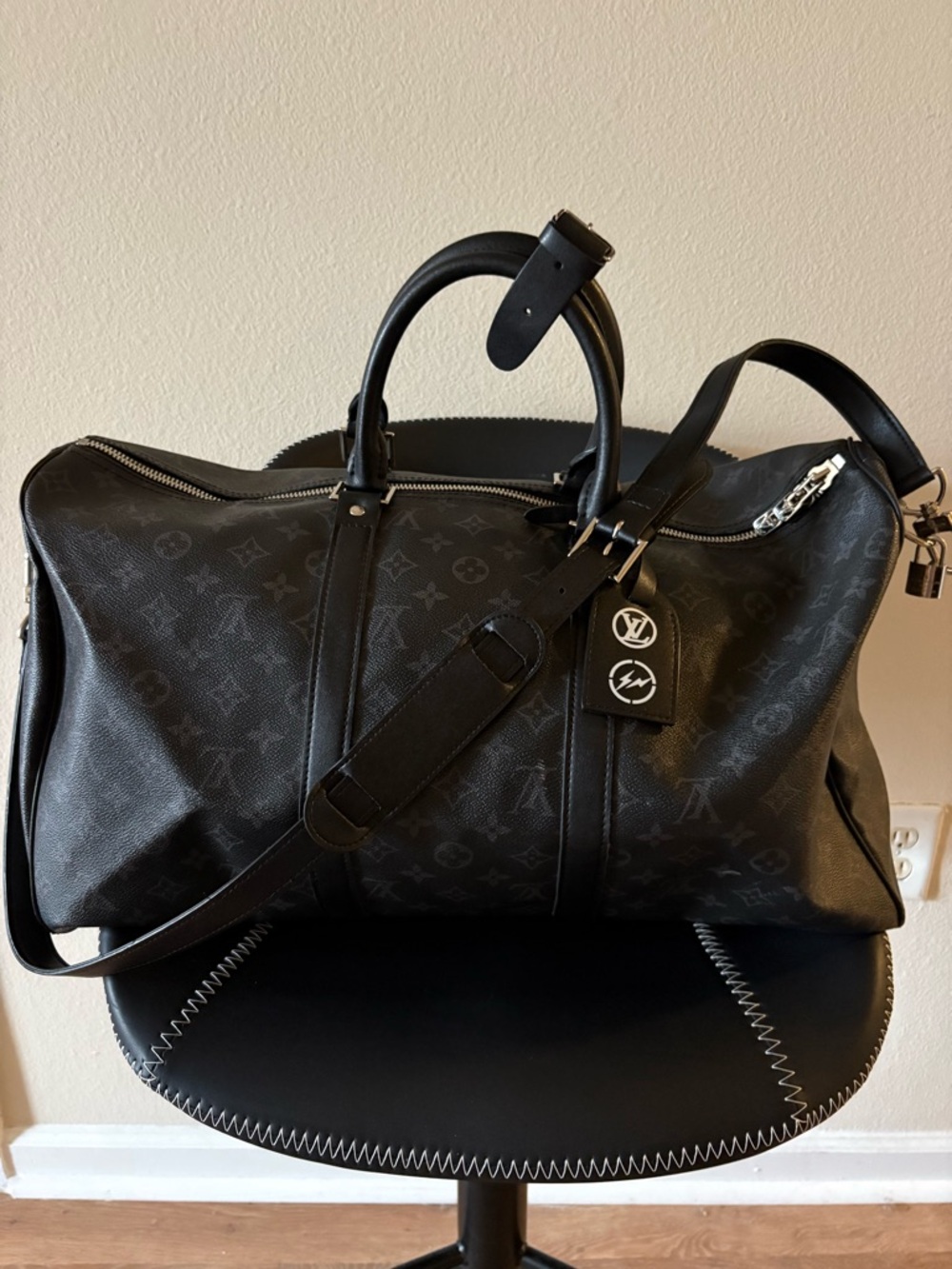 **SOLD**

Louis Vuitton Black Leather Travel Tote with White Monogram Discs